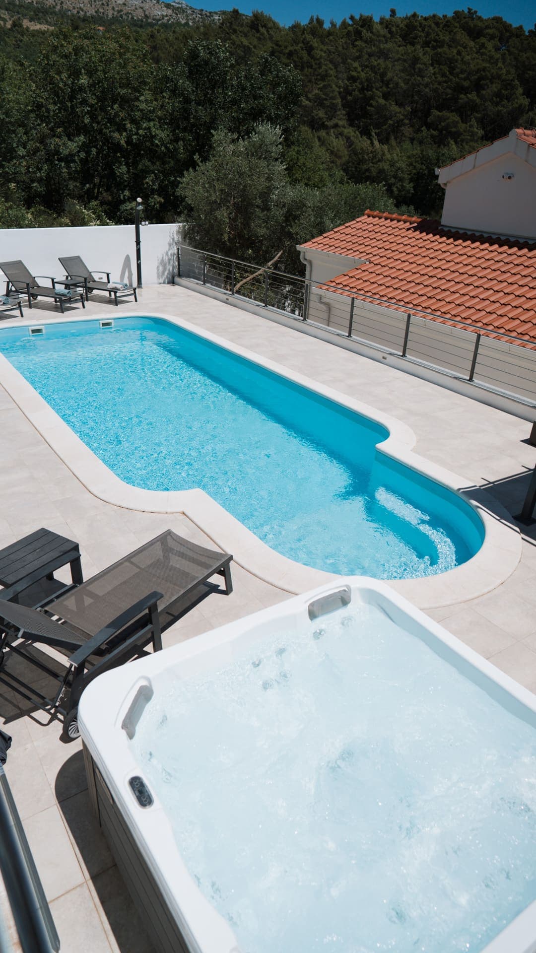 Heated pool and jacuzzi with mountain view